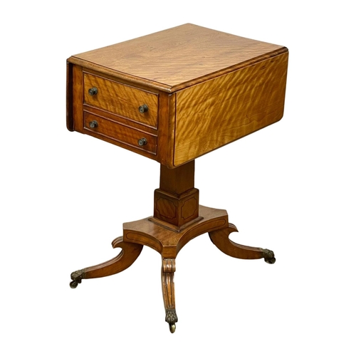 874 - A Regency Satin Birch pedestal drop leaf side table with 2 drawers and 2 dummy drawers, and on brass... 