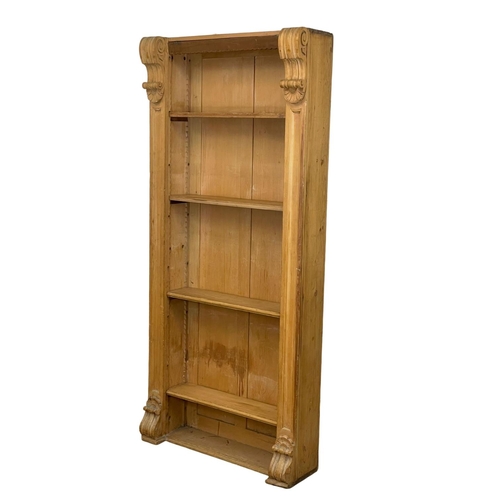 882 - A tall Victorian pine open bookcase with adjustable shelves. 89 x 26 x 196cm