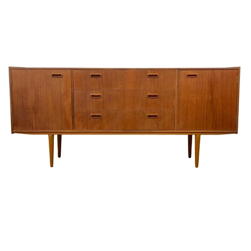 888 - A 1960’s Mid Century teak sideboard, with 3 drawers and 2 cupboards. 168 x 40 x 76cm