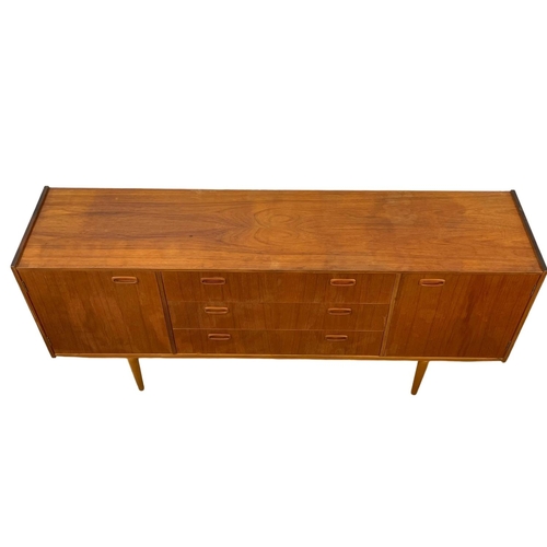 888 - A 1960’s Mid Century teak sideboard, with 3 drawers and 2 cupboards. 168 x 40 x 76cm