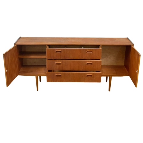 888 - A 1960’s Mid Century teak sideboard, with 3 drawers and 2 cupboards. 168 x 40 x 76cm