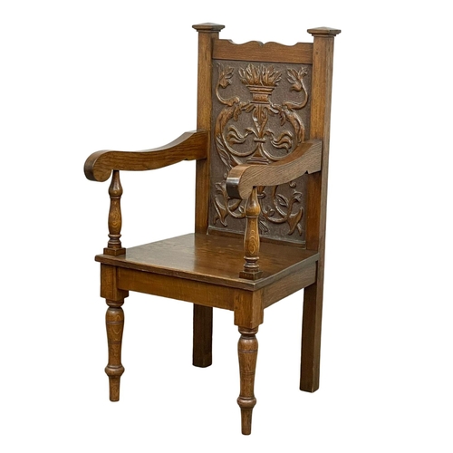 896 - A large late 19th century carved oak armchair. Circa 1890-1900.