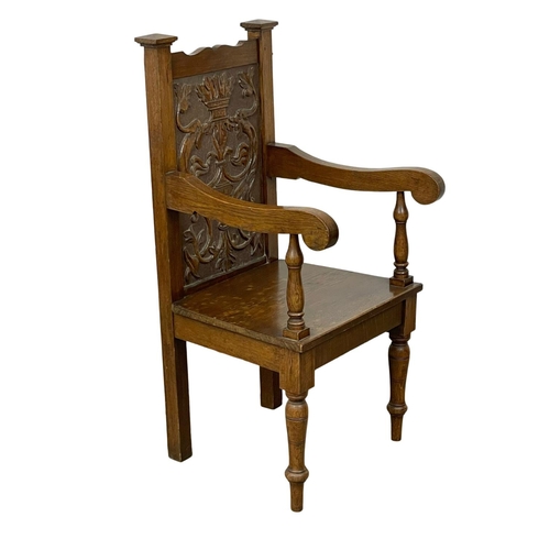 896 - A large late 19th century carved oak armchair. Circa 1890-1900.