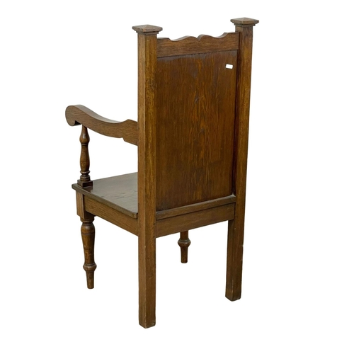 896 - A large late 19th century carved oak armchair. Circa 1890-1900.