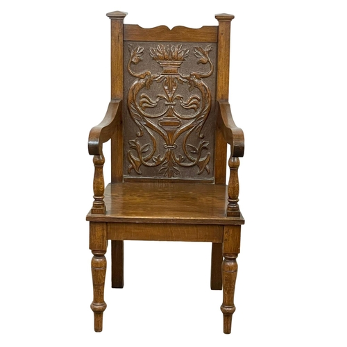 896 - A large late 19th century carved oak armchair. Circa 1890-1900.