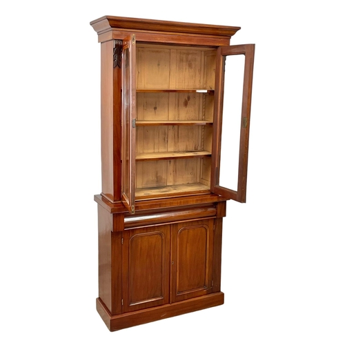 900 - A Victorian mahogany bookcase, with double glazed doors and drawer. 90 x 36.5 x 201cm