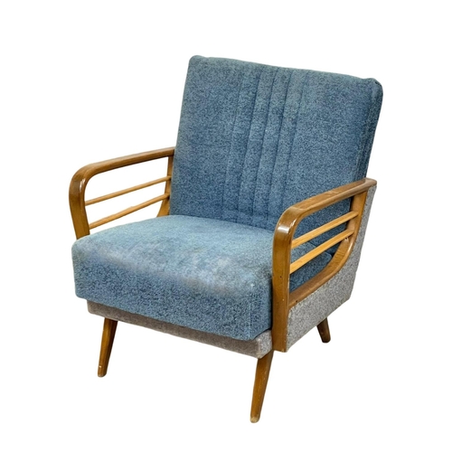 904 - A 1950’s Mid Century continental solid beech framed armchair, with original upholstery. 64 x 79 x 74... 