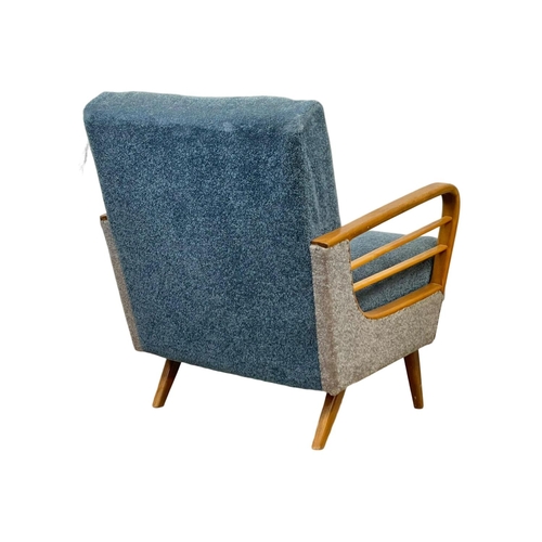 904 - A 1950’s Mid Century continental solid beech framed armchair, with original upholstery. 64 x 79 x 74... 