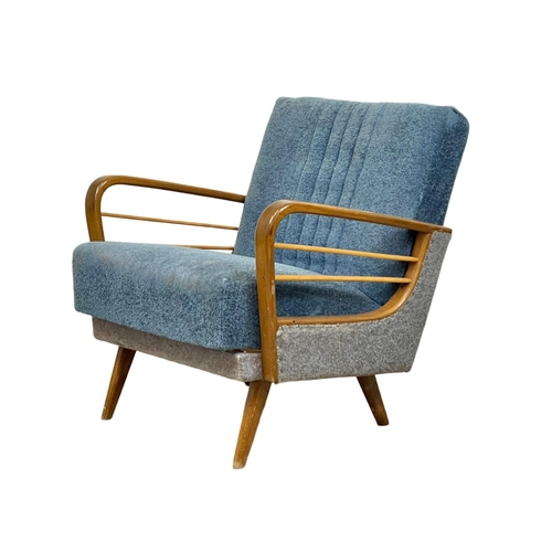 904 - A 1950’s Mid Century continental solid beech framed armchair, with original upholstery. 64 x 79 x 74... 