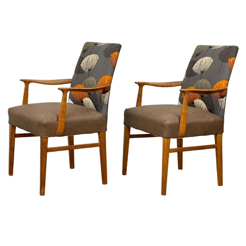 905 - A pair of good quality Mid Century teak carver armchairs. 1960’s.