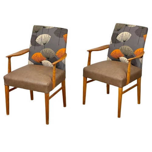 905 - A pair of good quality Mid Century teak carver armchairs. 1960’s.