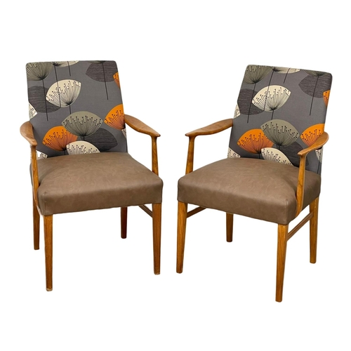 905 - A pair of good quality Mid Century teak carver armchairs. 1960’s.