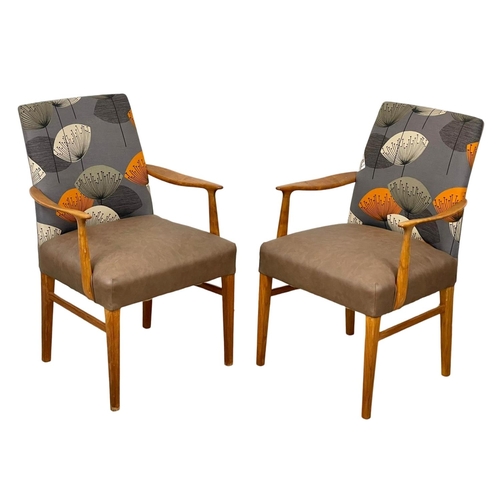 905 - A pair of good quality Mid Century teak carver armchairs. 1960’s.