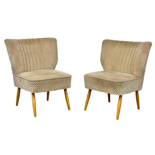 907 - A pair of 1950’s Mid Century style cocktail chairs with original upholstery.