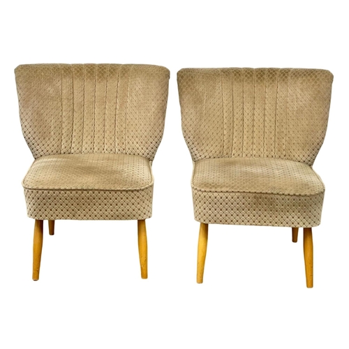 907 - A pair of 1950’s Mid Century style cocktail chairs with original upholstery.