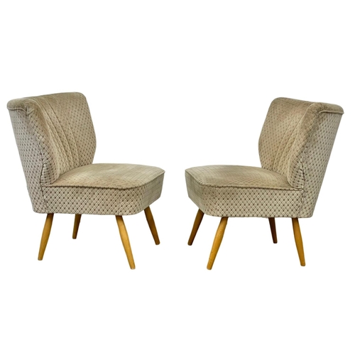 907 - A pair of 1950’s Mid Century style cocktail chairs with original upholstery.