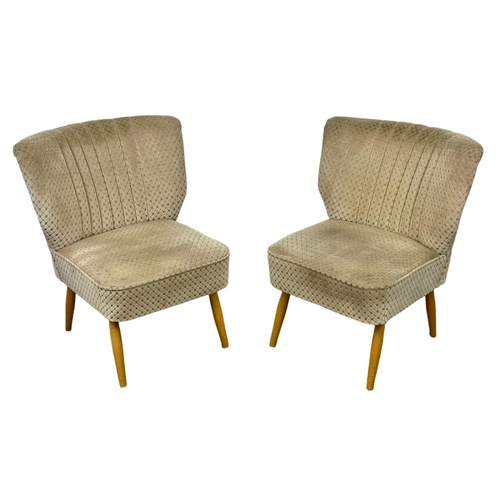 907 - A pair of 1950’s Mid Century style cocktail chairs with original upholstery.