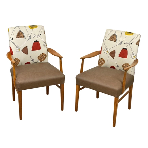 908 - A pair of good quality Mid Century teak carver armchairs. 1960’s.