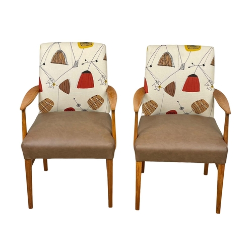 908 - A pair of good quality Mid Century teak carver armchairs. 1960’s.