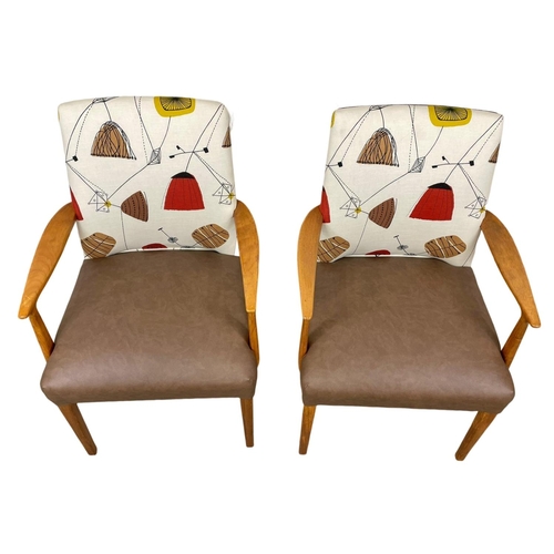 908 - A pair of good quality Mid Century teak carver armchairs. 1960’s.