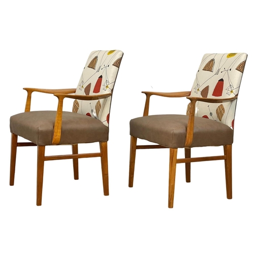 908 - A pair of good quality Mid Century teak carver armchairs. 1960’s.