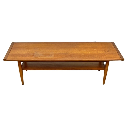 911 - A Mid Century 2 tier teak “surfboard” coffee table, by Myer. 1960’s 114 x 38 x 35.5cm