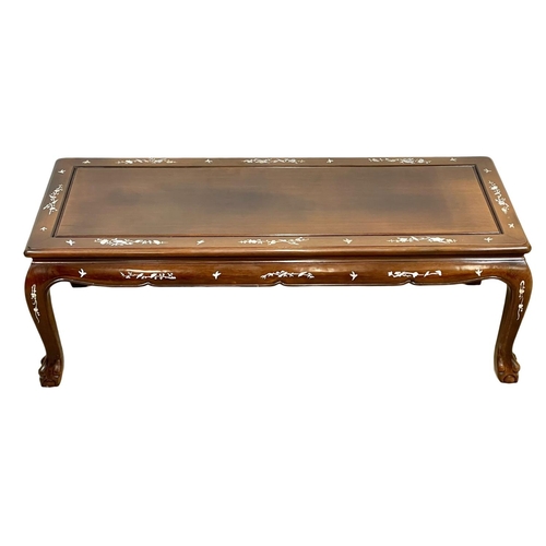 918 - A Chinese style coffee table with mother of pearl inlay. 124 x 50 x 42cm