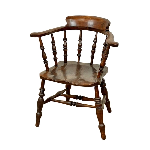 938 - A Victorian elm and beech armchair.