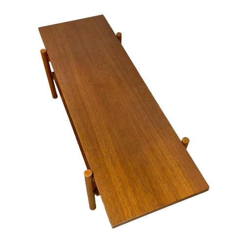 953 - A Mid Century teak 2 tier coffee table. 132 x 50 x 40cm