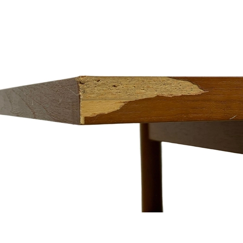 953 - A Mid Century teak 2 tier coffee table. 132 x 50 x 40cm