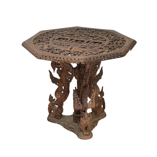 958 - A late 19th century ornate Burmese carved teak pedestal table. Circa 1890-1900. 76.5 x 68.5cm