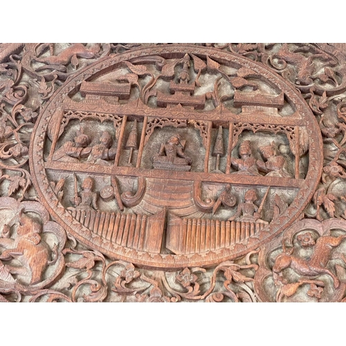 958 - A late 19th century ornate Burmese carved teak pedestal table. Circa 1890-1900. 76.5 x 68.5cm