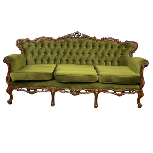 968A - A vintage ornate Italian carved button back sofa. 201cm