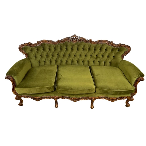 968A - A vintage ornate Italian carved button back sofa. 201cm