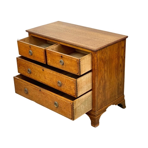 978 - An Edwardian oak chest of drawers. 99 x 50 x 80cm