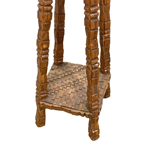 980 - A heavily carved plantstand. 72cm