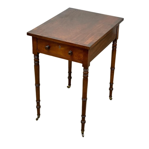 981 - A George IV mahogany double drawer side table with rosewood cross banding. Circa 1820. 47.5 x 61 x 7... 