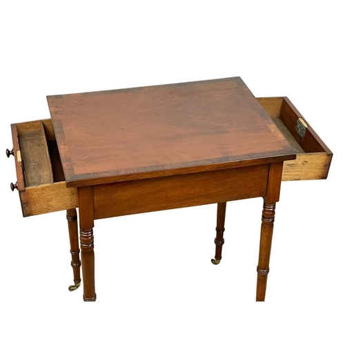 981 - A George IV mahogany double drawer side table with rosewood cross banding. Circa 1820. 47.5 x 61 x 7... 