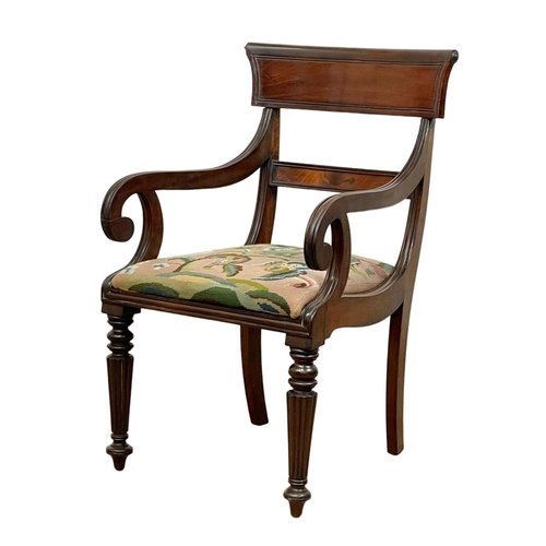 984 - A good quality George IV mahogany bar back armchair with reeded legs. Circa 1820.