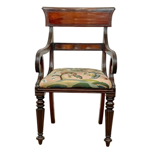 984 - A good quality George IV mahogany bar back armchair with reeded legs. Circa 1820.