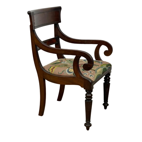 984 - A good quality George IV mahogany bar back armchair with reeded legs. Circa 1820.