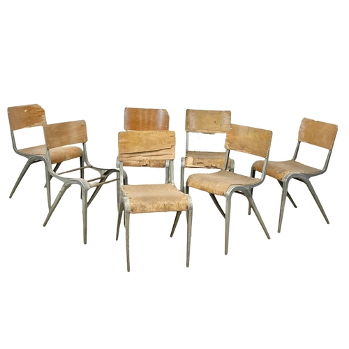 993 - A set of 7 vintage Esavian metal framed stacking chairs.