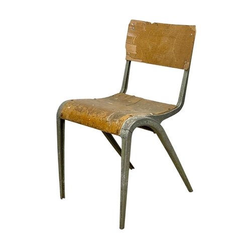 993 - A set of 7 vintage Esavian metal framed stacking chairs.