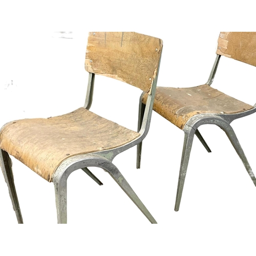 993 - A set of 7 vintage Esavian metal framed stacking chairs.