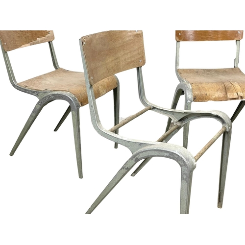 993 - A set of 7 vintage Esavian metal framed stacking chairs.