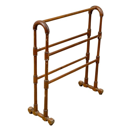 942 - An Edwardian towel rail. 70 x 81cm