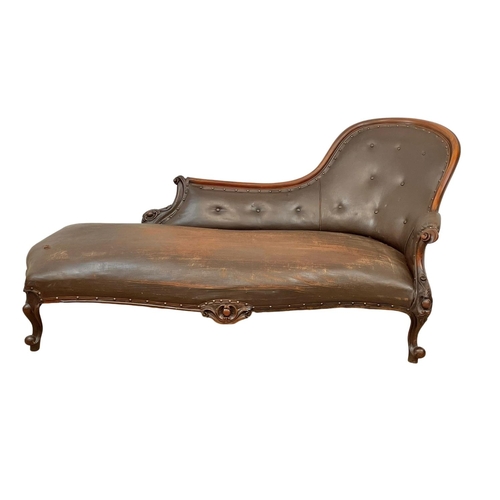 855 - A Victorian carved mahogany chaise lounge with early 20th century leather. 178cm