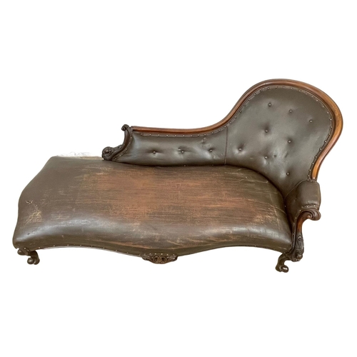 855 - A Victorian carved mahogany chaise lounge with early 20th century leather. 178cm