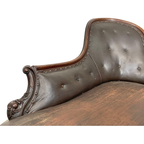 855 - A Victorian carved mahogany chaise lounge with early 20th century leather. 178cm