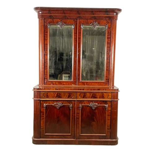 859 - A large Victorian mahogany bookcase, with mirrored doors and 2 drawers. 157 x 61 x 243cm